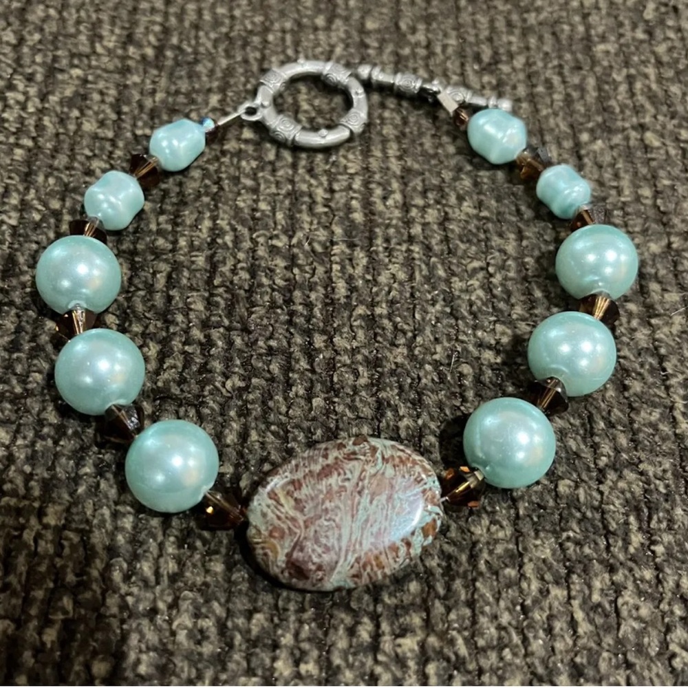 Jasper Blue and brown striped Jasper bracelet. 9 inches long. Toggle closure